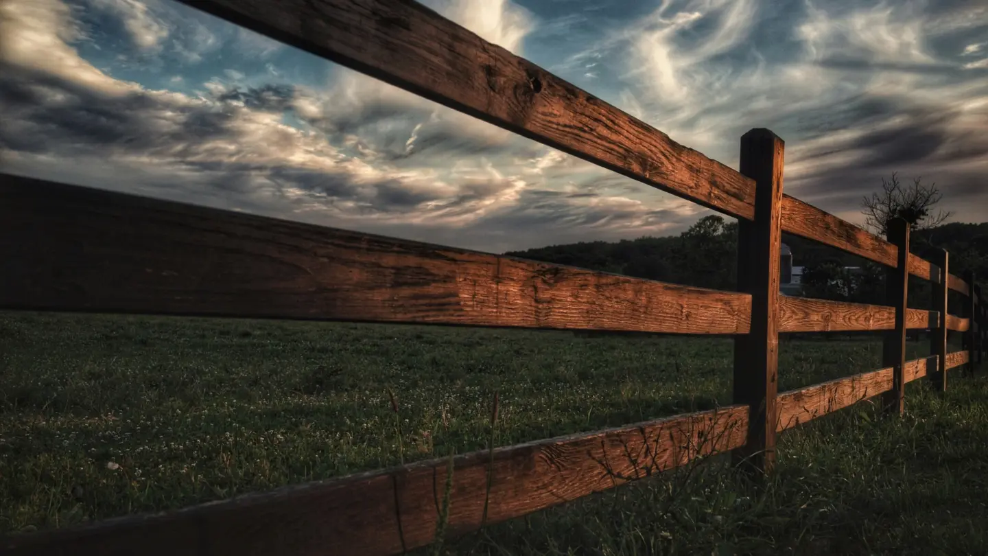 A agricultural privacy fence installation with cloudy sky view in miami valley oh