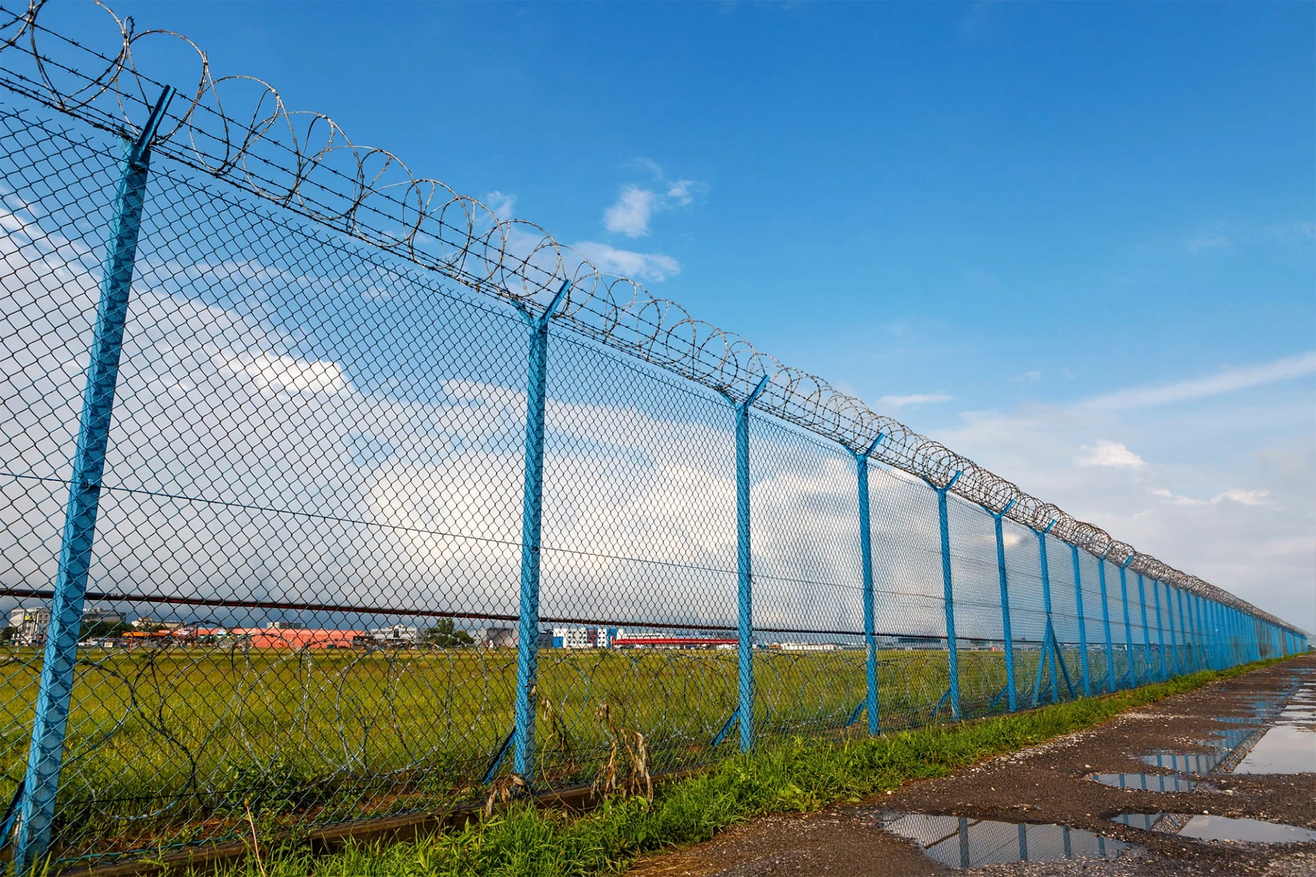 Barbed wire security fence of a restricted area under blue sky in miami valley oh