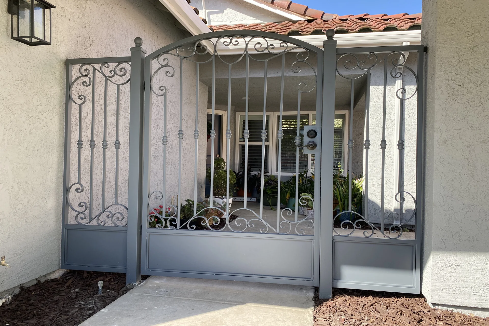 Black metal gate in front white windows in miami valley oh