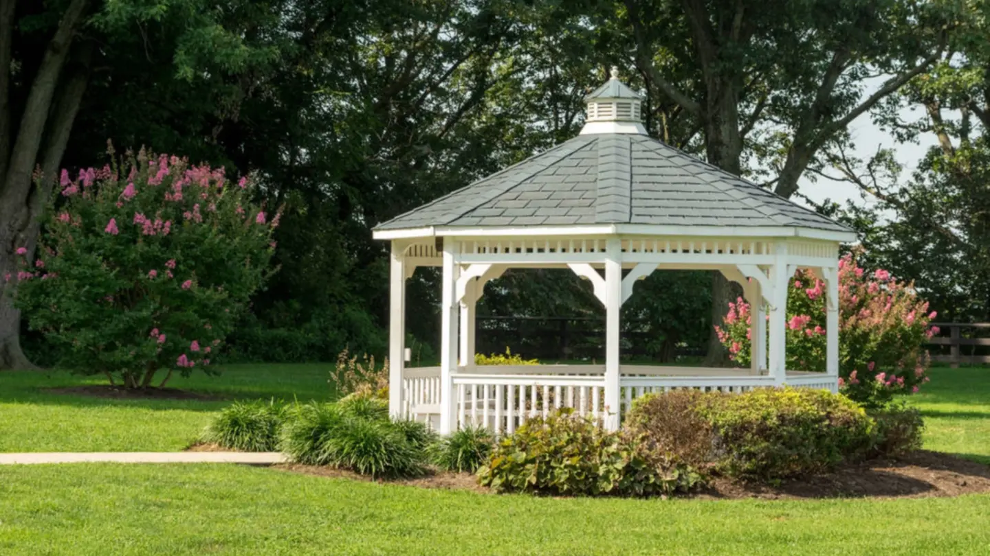 Pavilion gazebo with a bench in a garden park in miami valley oh