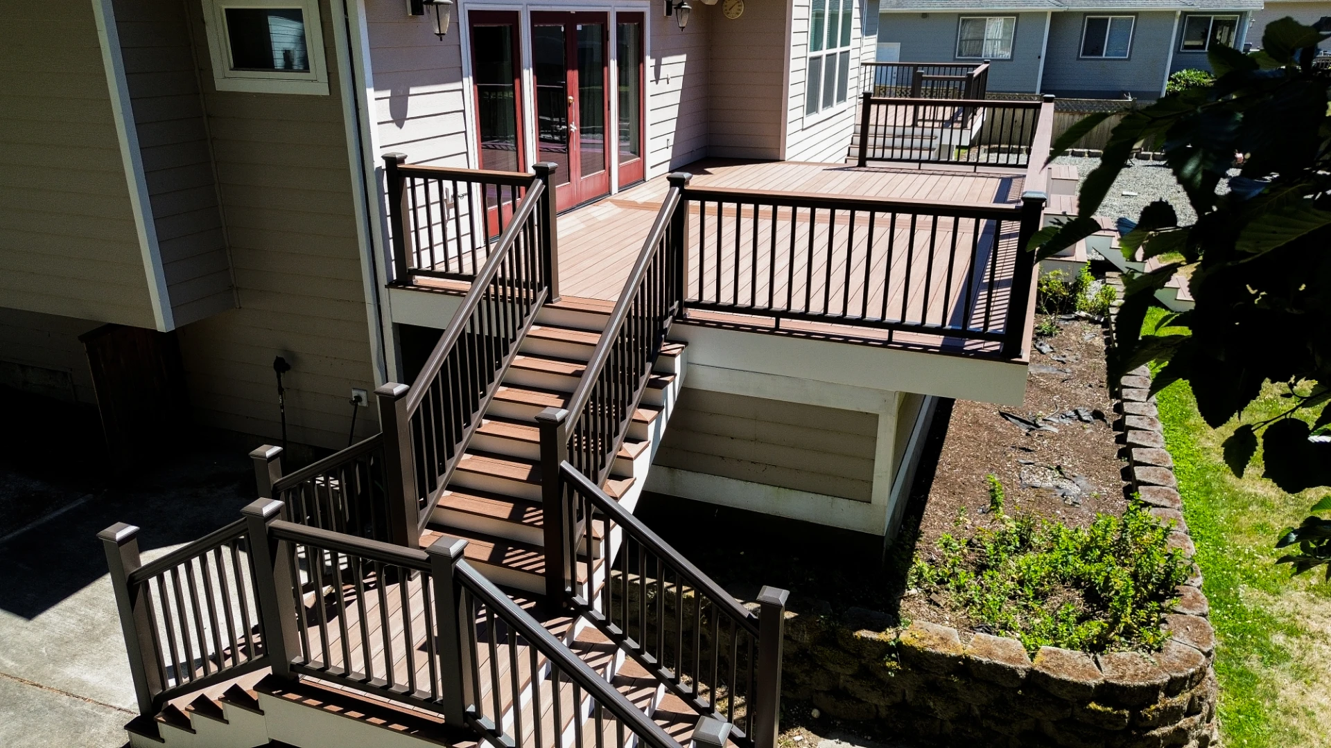 Pressure treated wood under deck with black railing in miami valley oh